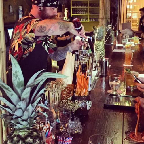 A bartender at Latitude 29 serves up authentic tiki cocktails during the restaurant's grand opening. (Photo courtesy Emery Finnegan)