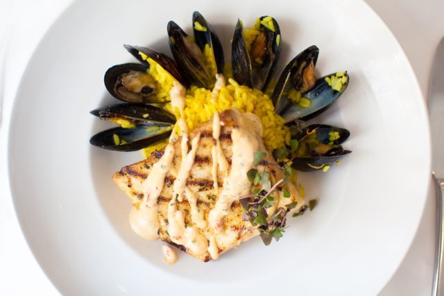 Eating at Criollo Restaurant for dinner during COOLinary? Our Grilled Cobia with Blue Mussels, Saffron Rice, and Red Pepper-Garlic Aioli is one of our delicious entrée options.